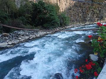 PB121884_1024px Gangqu River (Blue River) at the entrance to the Bala Gezong Scenic Area, planted pelargonias, 2270 m