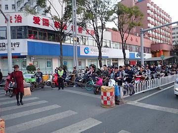 PA260170_1024px Kunming, traffic control, eletric scooters were common